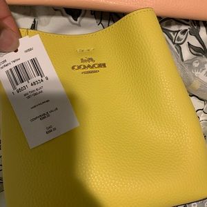 Never worn tag still on Coach cross over bag
